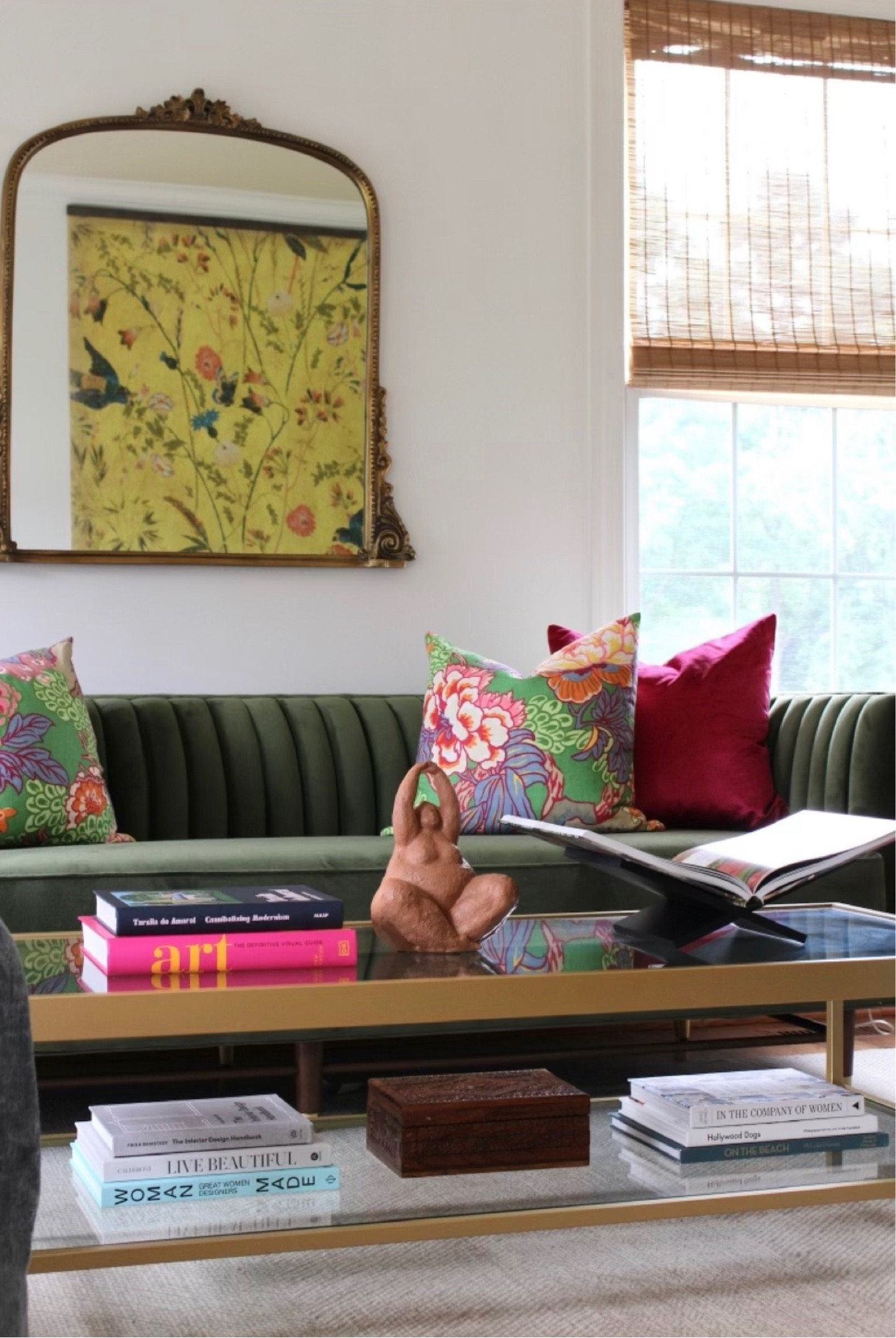 Coffee table decor, accessories, glass table, colorful decor, pop of color, coffee table books, gold mirror, living room, green couch, decorative pillows, pink pillow, pattern pillows, colorful artwork

#LTKhome #LTKunder50