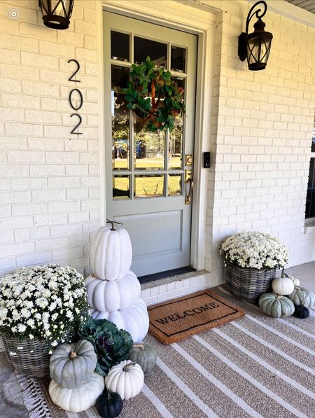 Fall front porch decor! 
Layered doormat, fall wreath, pumpkin decor, planters 

#LTKhome #LTKSeasonal #LTKfindsunder100