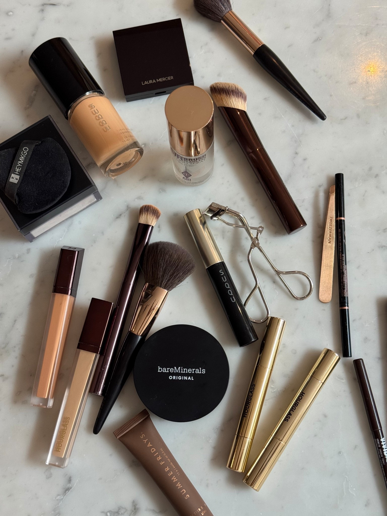 Pressed Powder - Bare minerals in shade Golden Medium 14 
Concealer- Hourglass shade Beech and Topaz
Blush - Laura Mercier shade Watermelon 
Foundation - SUQQU shade 030 
Loose powder - Huda beauty shade Pound Cake 
SPF - Murad 
Mascara - SUQQU Waterproof mascara 
Brow pencil - Anastasia Beverly Hills Brow Wiz shade Medium Brown
Liquid liner - NYX shade brown 
Lip balm - Hourglass phantom glossy balm in shade Crave and Rouse 
Summer Fridays lip balm in shade Iced Coffee 