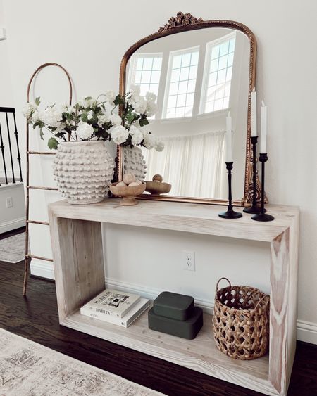 neutral entryway idea 🌿

decided that this area needed a subtle change! So I switched up the decor here with other things I had in my sala on my bookshelves, lil switcharoo if you will 🤭

anywho, here’s some details here:
+ opted for a grouping of three on the bottom
+ candleholders: pottery barn look for less from Amazon 
+ candles: battery operated and love them! 
+ textured vase: size large here
+ boxes, basket, books, pedestal bowl: Target
+ cute wooden balls: new home find I am loving

Everything here will be linked in my bio! What do you think? 🤍



#LTKhome #LTKFind #LTKunder50