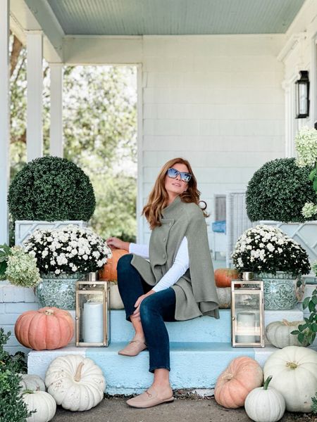 Our fall front porch filled with pumpkins, green and white planters,Chippendale planters,white mums, brass lanterns, and faux boxwoods. Happy Fall! 

#LTKhome #LTKHalloween #LTKSeasonal