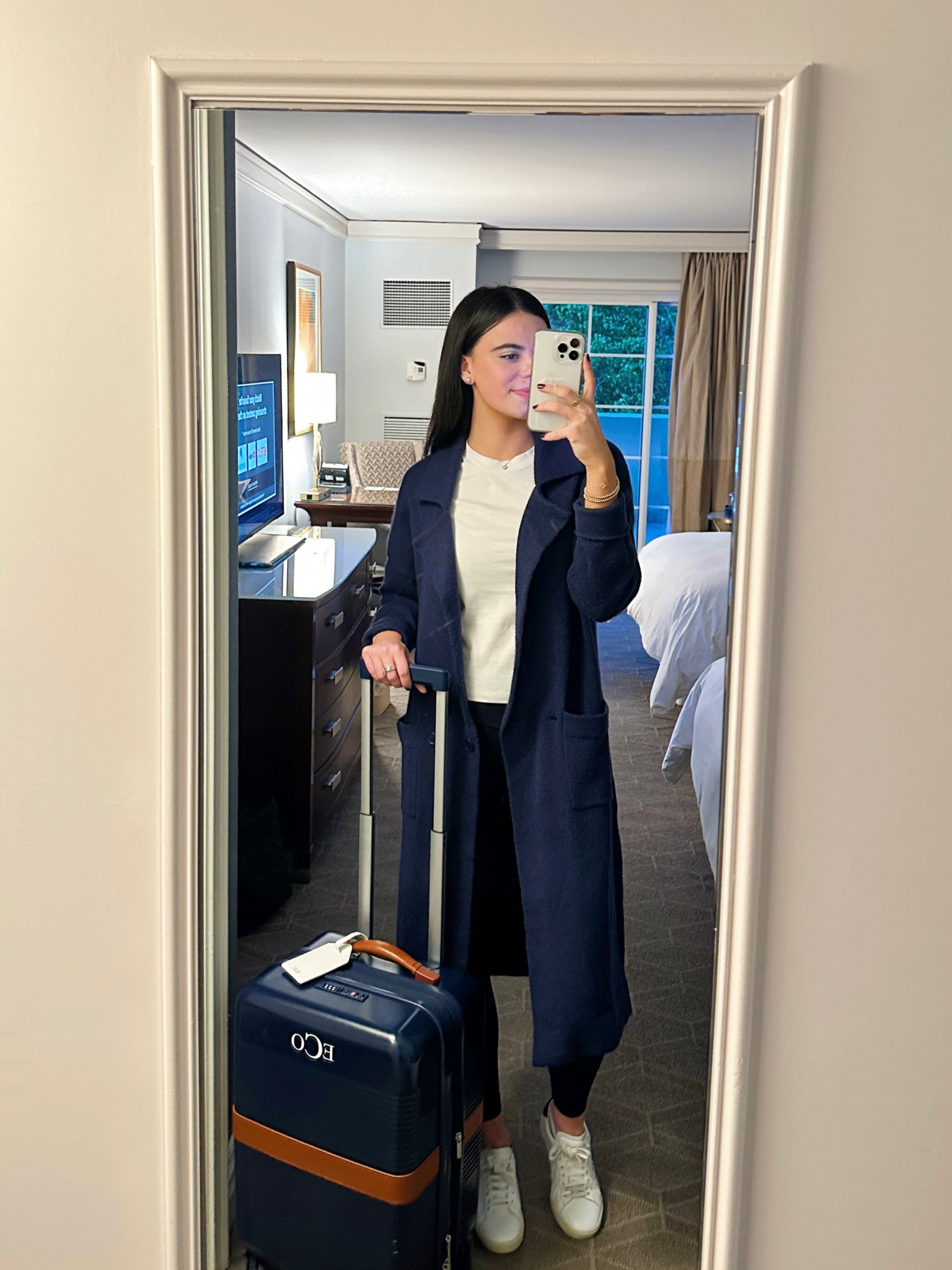 My travel ootd! My navy coatigans is from Amazon, leggings Lululemon, basic white tea Madewell, and luggage was gifted to me by Mark & Graham!✈️

#LTKtravel #LTKSeasonal #LTKGiftGuide
