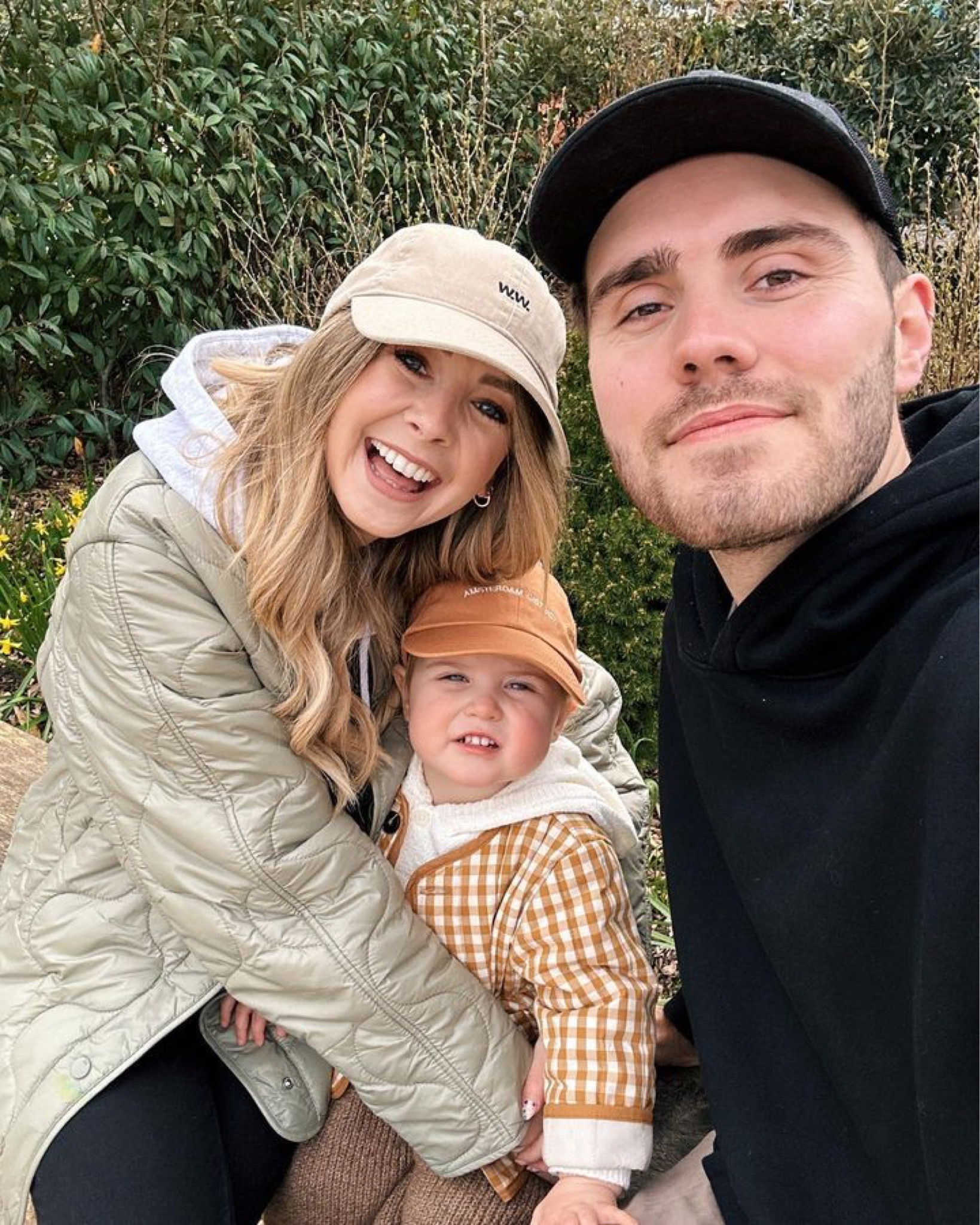 Family selfie, beige raincoat jacket, beige cap, black hoodie, black cap, orange cap, checkered jacket, baby toddler outfit 

#LTKfamily #LTKbaby #LTKfit