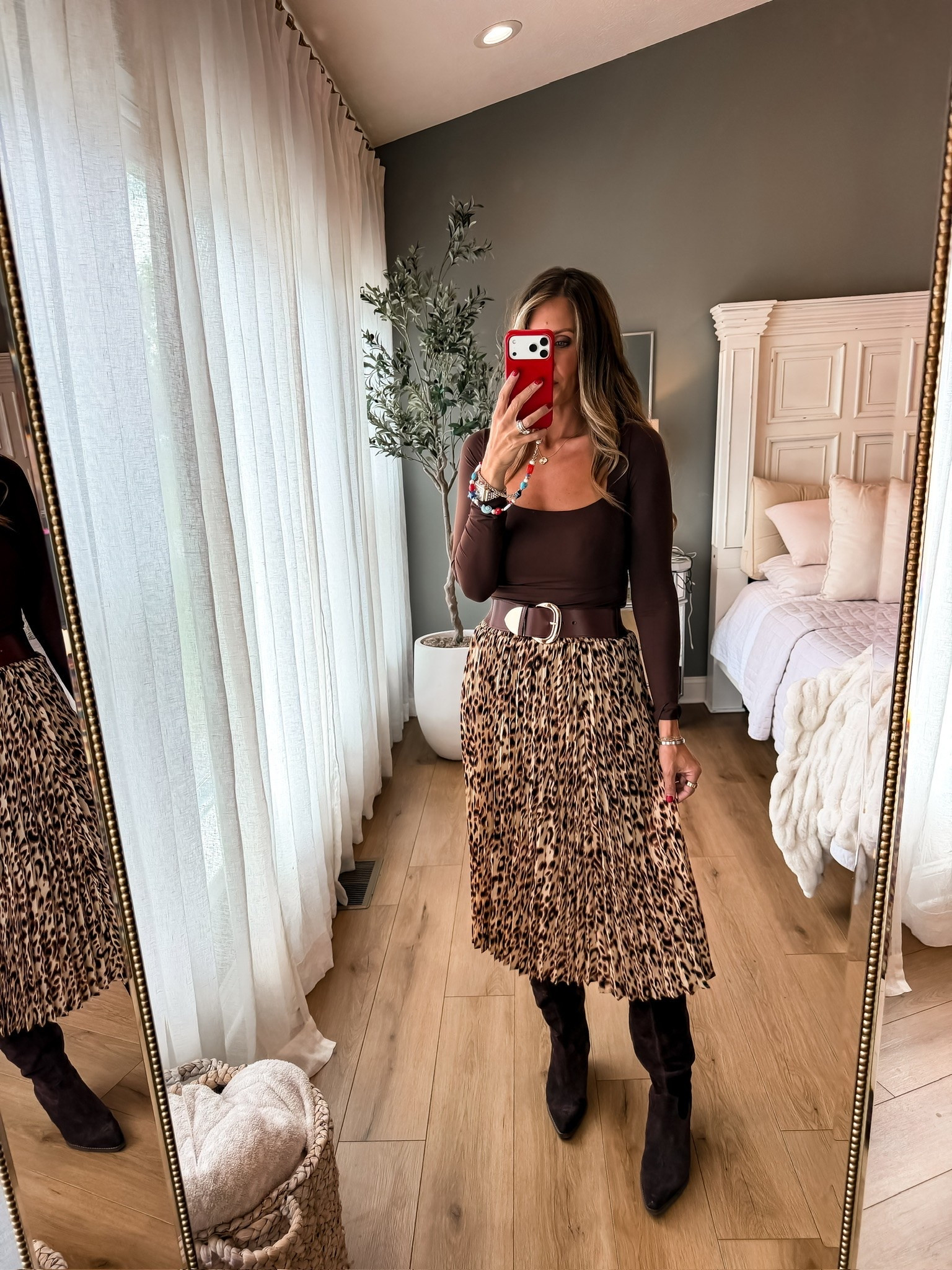 This leopard pleated skirt is such a fun fall piece, especially paired with chocolate brown. I love the movement of the pleats with the tall boots and wide belt for a look that feels dressed up without being too much.

leopard skirt, pleated midi skirt, fall skirt outfit, chocolate brown top, tall boots, fall fashion, animal print skirt, autumn outfit, women’s fall style, midi skirt outfit, TheMomInStyle

#LTKSeasonal #LTKootd #LTKWorkwear