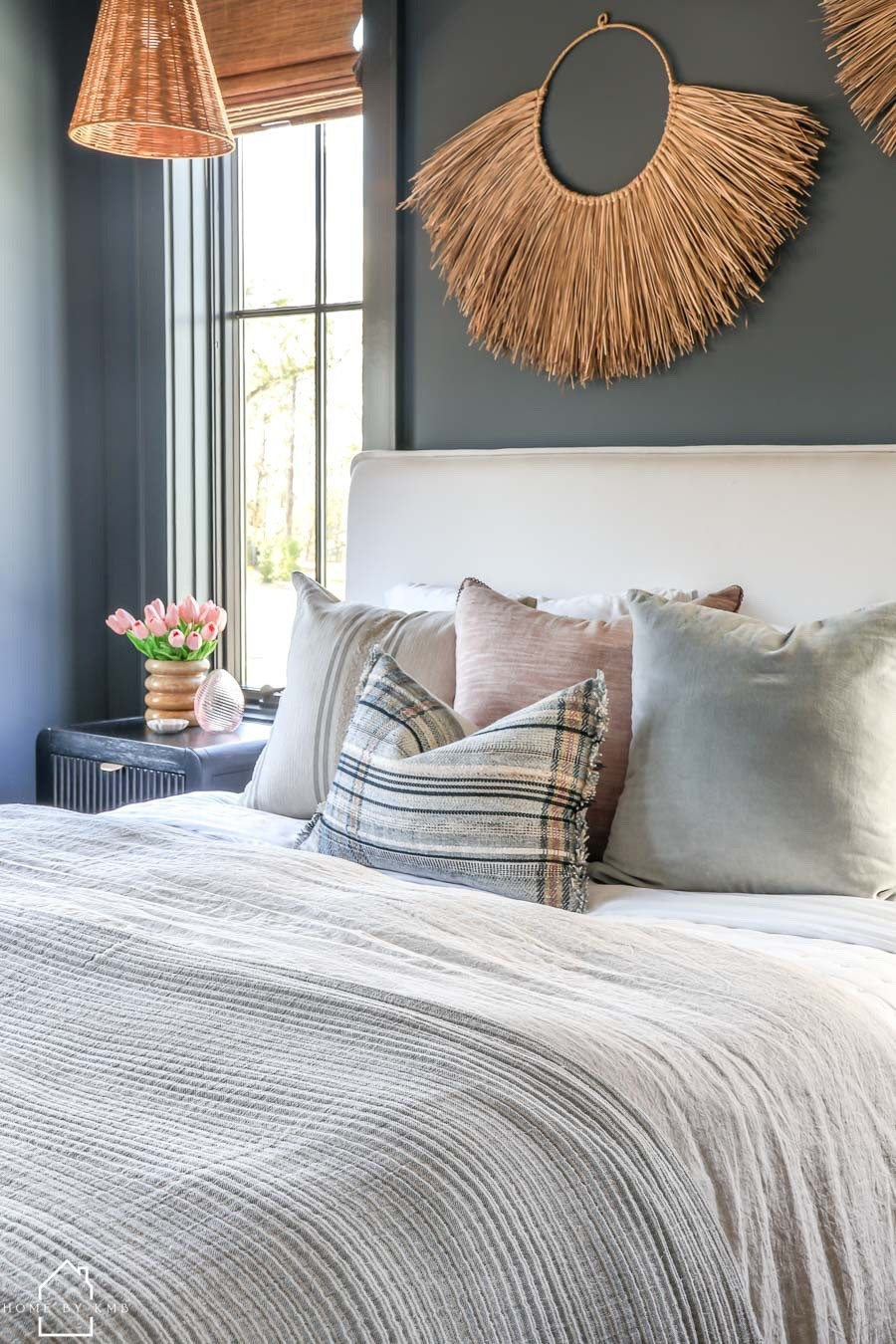 Spring bedroom 💕 I layered soft neutrals with subtle blush accents to keep my guest bedroom feeling fresh, calm, and effortlessly inviting. The contrast of the moody wall adds depth, while natural textures—woven lighting, warm wood, and tactile linens—bring in that light, organic feel I crave this time of year! ☀️

#LTKHome #LTKSeasonal