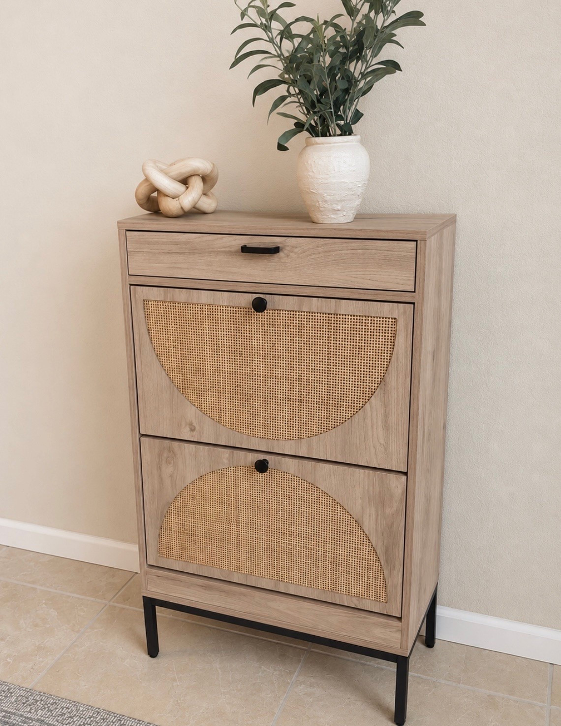 ✨⬇️ I just got this McGee style shoe cabinet and I’m honestly SO impressed with it 🙌

it’s only $94 right now — over 50% OFF

looks WAY more expensive in person and is such a good piece for small entryways or narrow spaces

✔ hidden storage for up to 12 pairs of shoes  
✔ slim design that doesn’t stick out too far  
✔ cane detail doors  
✔ drawer storage on top  
✔ warm neutral wood tones + black accents

I styled mine with a vase + greenery and love how elevated it makes the space feel without taking up much room 🤍

I’ll link this plus more of my favorite deals from the brand right now ✨

#LTKMothersDay #LTKmomlife #LTKdayinmylife