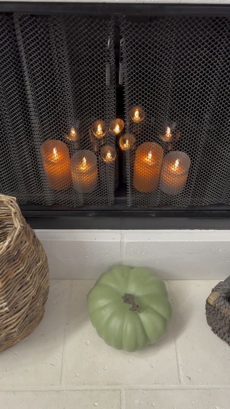 Halloween decor. Flameless candles with remote (4 sets shown here), green pumpkin, fall fireplace hearth.

#LTKSeasonal #LTKhome #LTKHalloween