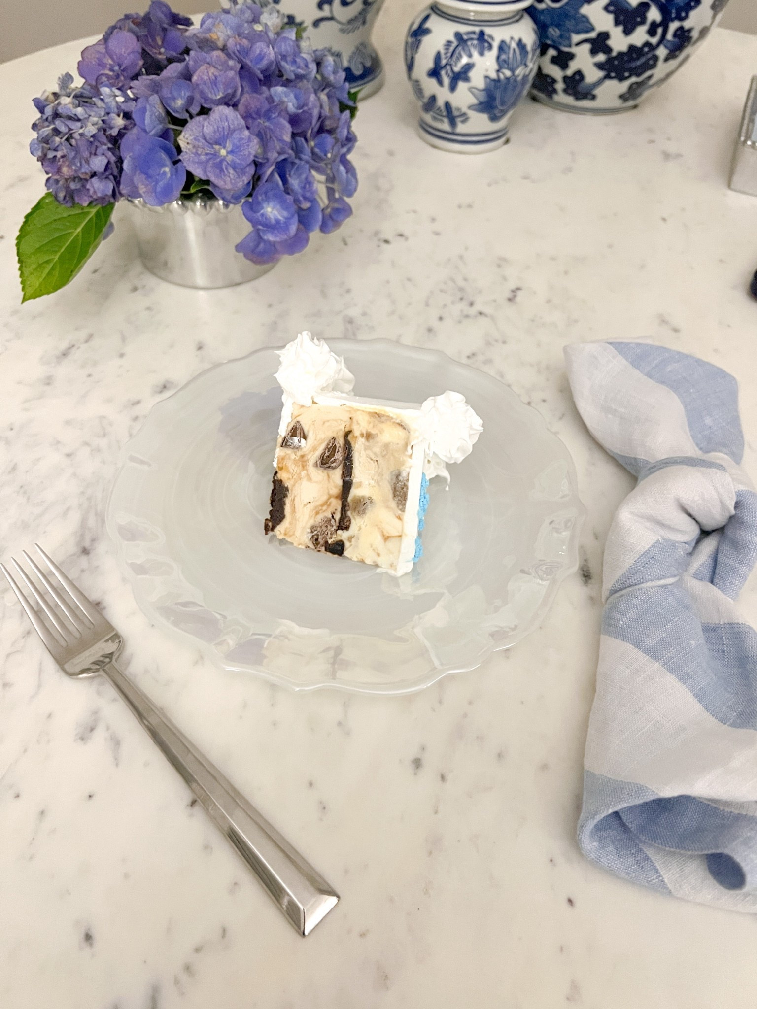 Used this silver beaded wine bottle holder as a adorable little vase for a couple hydrangea stems from the garden for the perfect coastal new England centerpiece for summer

#LTKSeasonal #LTKFindsUnder50 #LTKHome