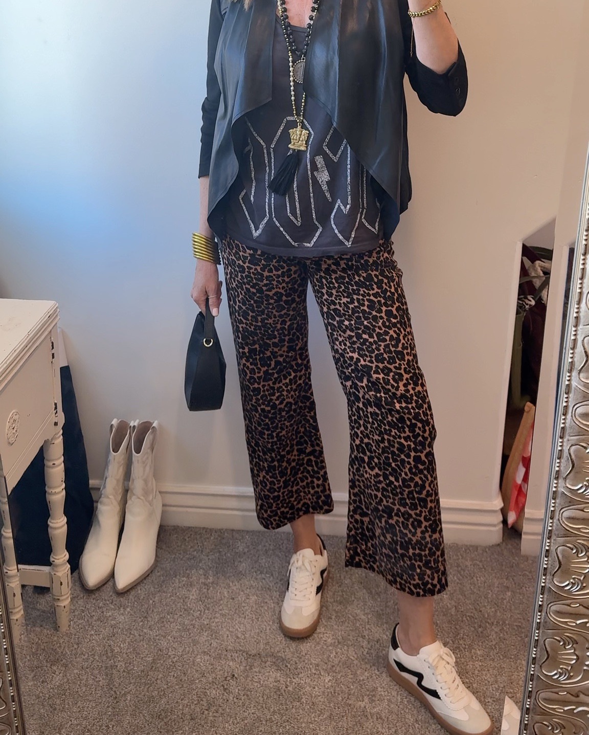 Over 50 Styling
Cool girl vibes…

# 5
in the Concert/graphic Tee styling Series✔️

Styling concert tee with 
leather & leopard
For day with stylish tennis
Shoes and a plain leather bag 
Keep the look casual.
Want to dress it up? Add heels and. Studded bag!

Items you probably 
Have in your closet!
-Leather Jacket or pants
(Mine is a deal front faux leather by Kut from kloth old )

-Leopard  pants or jacket
(Mine are the collet pant tts I am in 27)

-Graphic tee 
(Mine is AC/DC tank top by)

Junk food 
-Tennis shoes
(Yellow box tts)

-Black Bag
(Leather by Chicos) linked similar

-long necklaces
(Mine are not linkable). Linked similar options

Layer on the bracelets

Tip: keep the metal simple
Not to over power the necklaces. 


#LTKStyleTip #LTKWatchNow #LTKOver40