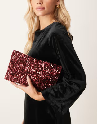 True Decadence all-over sequin envelope clutch bag in burgundy | ASOS (Global)
