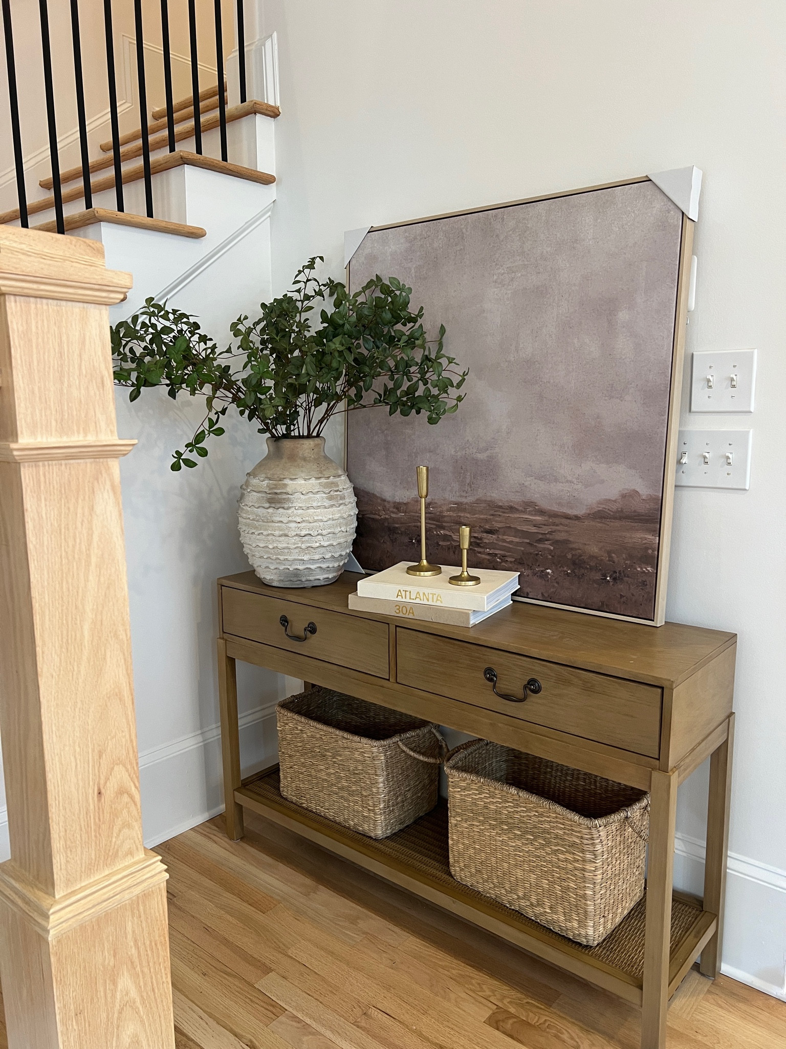 Console table area. 

I’ve been playing around with different bases and stems and artwork and mirrors to see what I want in this corner! 

#LTKhome #LTKSeasonal