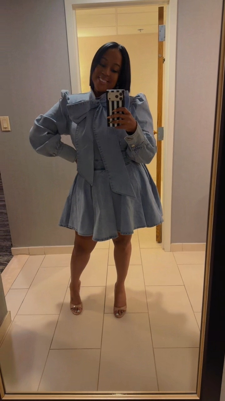 This @AKIRA  denim dress is EVERYTHING 💙 The quality? 10/10. I’m wearing an XL, but honestly could’ve sized down to a Large because it does have a little stretch. The oversized bow detail is what really sold me though… super chic, super girly, and such a statement piece ✨ Paired her with my @Steve Madden US  needle heel mules and babyyy it’s a LOOK