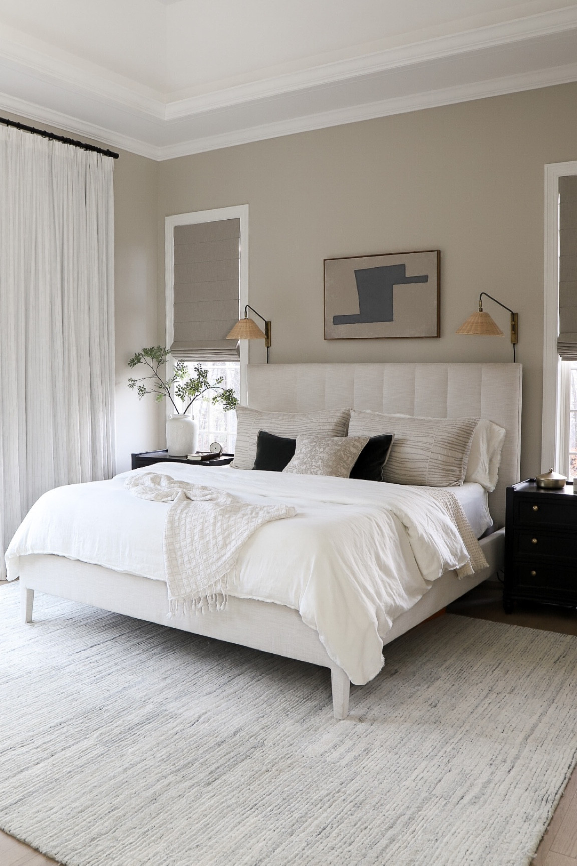 Master bedroom, upholstered bed, modern art, abstract art, throw pillows, sconces, shades, duvet cover, comforter, throw blanket, night stands, vase, faux plants, home decor, neutral home 

#LTKhome #LTKSeasonal #LTKstyletip