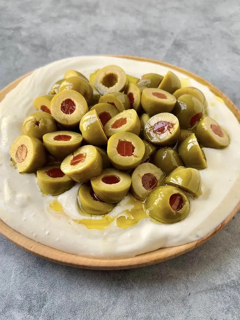 Christmas App Idea 

Ingredients
* 10 oz cold cream cheese
* 1/2 oz cold sour cream
* 2 oz blue cheese
* 1 oz gin plus more for marinating
* 1 oz olive brine plus more for marinating
* 8 oz martini olives halved
* Kosher salt
* 3 tbsp extra-virgin olive oil

Instructions 
* In a small bowl, combine the olives, olive oil, a splash of gin, and a splash of olive brine. Toss to combine and marinate until ready to serve. 
* In a food processor, combine the cream cheese, sour cream, blue cheese, gin, olive brine, and a pinch of salt. Blend until smooth and creamy (it’s okay if some blue cheese chunks remain). 
* Transfer the dip to a serving plate or shallow bowl and spread into an even layer. Top with the marinated olives and spoon over as much marinade as you like. Serve immediately. 


https://ainttooproudtomeg.com/dirty-martini-dip-with-olives/

#LTKHoliday #LTKSeasonal #LTKHome