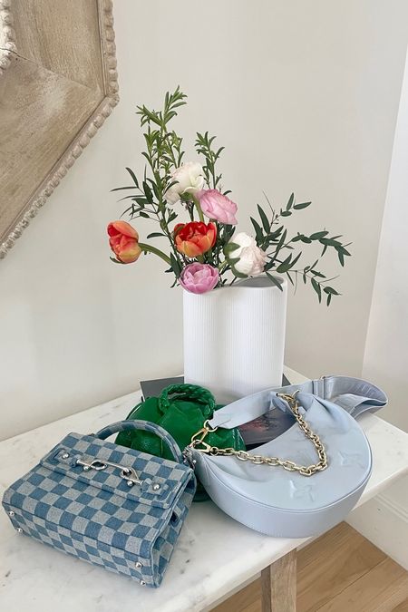 Spring things. 
Amazon vase
Rebecca Minkoff checkered bag
Shopbop purses 
Louis Vuitton
Flowers 

#LTKhome #LTKitbag #LTKSeasonal