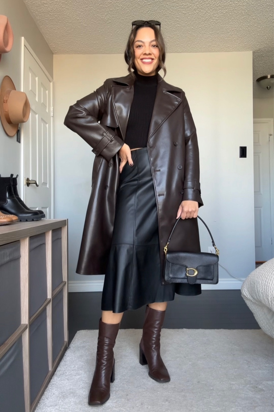 Fall outfit idea! Details below:
-Chocolate brown leather trench coat, similar linked.
-Coated black midi skirt, I have a size 8. Other similar skirts linked. 
-Black mock neck long sleeve top, I have a size medium. 
-Coach tabby shoulder bag 26 in black pebble leather  
-Brown ankle boots from Franco Sarto, similar pair from this year linked.
-Celine Triomphe 52mm sunglasses in black acetate. 

Vegan leather, fall trends, fall fashion  

#LTKfindsunder100 #LTKstyletip #LTKSeasonal