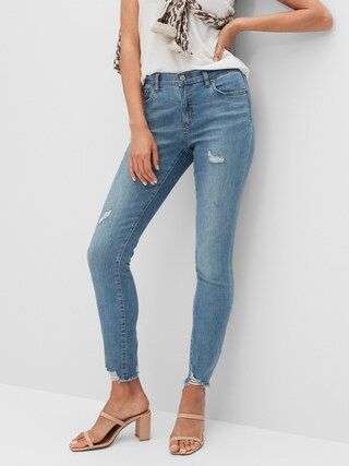 Mid-Rise Soft Touch Medium Wash Destructed Skinny Jean | Banana Republic Factory