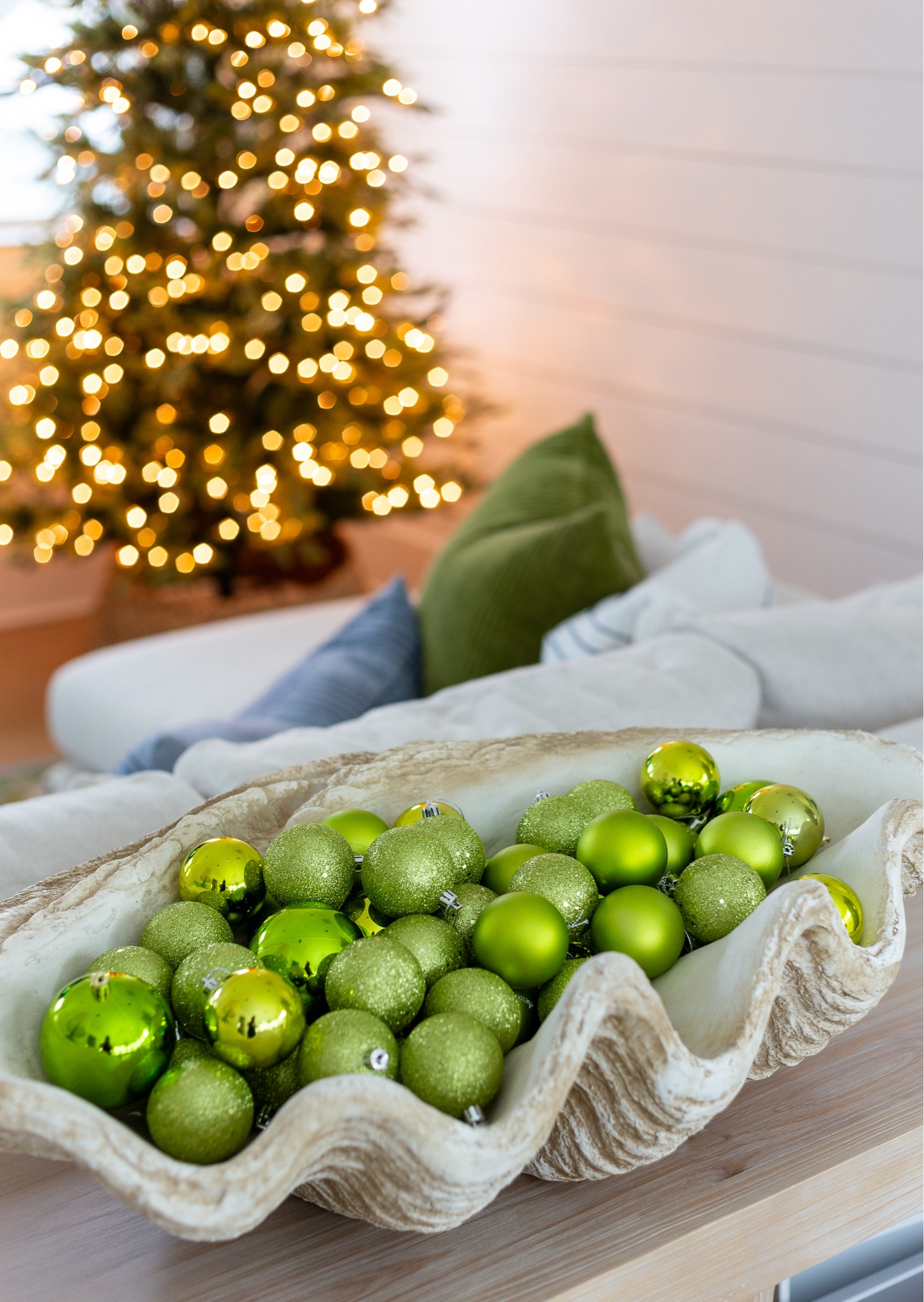 A simple way to decorate for Christmas is to fill bowls, tray or other items like this concrete clamshell with ornaments! I love using a mixed pack that includes matte ornaments, glitter ornaments and shiny ornaments! Also linking our favorite 9' Christmas tree, rattan cabinet, Frame FV, bottlebrush trees, light wood console table and linen sectional. #ltkhome #ltkholiday #ltkfindsunder50 #ltkstyletip #ltksalealert #ltkfindsunder100 #ltkstyletip 


#LTKSaleAlert #LTKHoliday #LTKHome