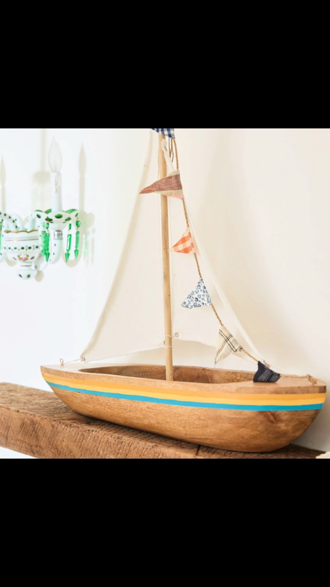 Every beautiful home tells a story. ⛵ This handcrafted wooden sailboat, carved from a single piece of wood with charming fabric sails, brings timeless coastal character to a bookshelf, console, or dining table.

#LTKHome #LTKSeasonal