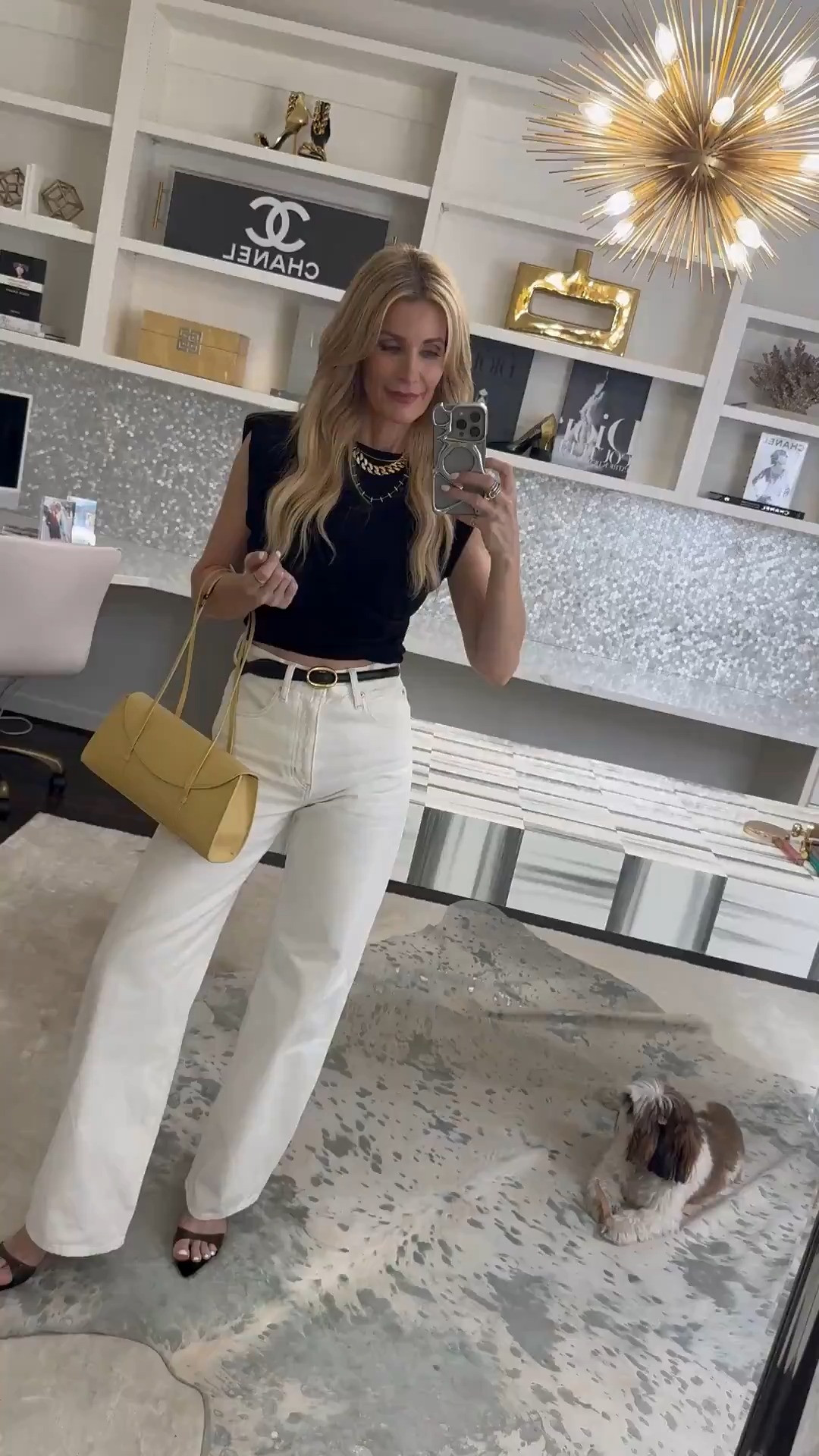 This black cropped tee is anything but basic 🙌 The slight shoulder pads + flattering ruching at the waist give it such a chic, elevated feel. Paired it with these high-waisted bow jeans (think soft barrel silhouette) and I’m obsessed 🤍 The white denim is so fresh for spring/summer. Finished the look with a butter yellow handbag for the perfect pop of color 💛 Everything runs true to size — wearing an XS in the tee. The jeans do run big, so size down one (I’m in a 23). Such an easy, polished everyday outfit ✨ 

 

#LTKgrwm #LTKootd #LTKOver40