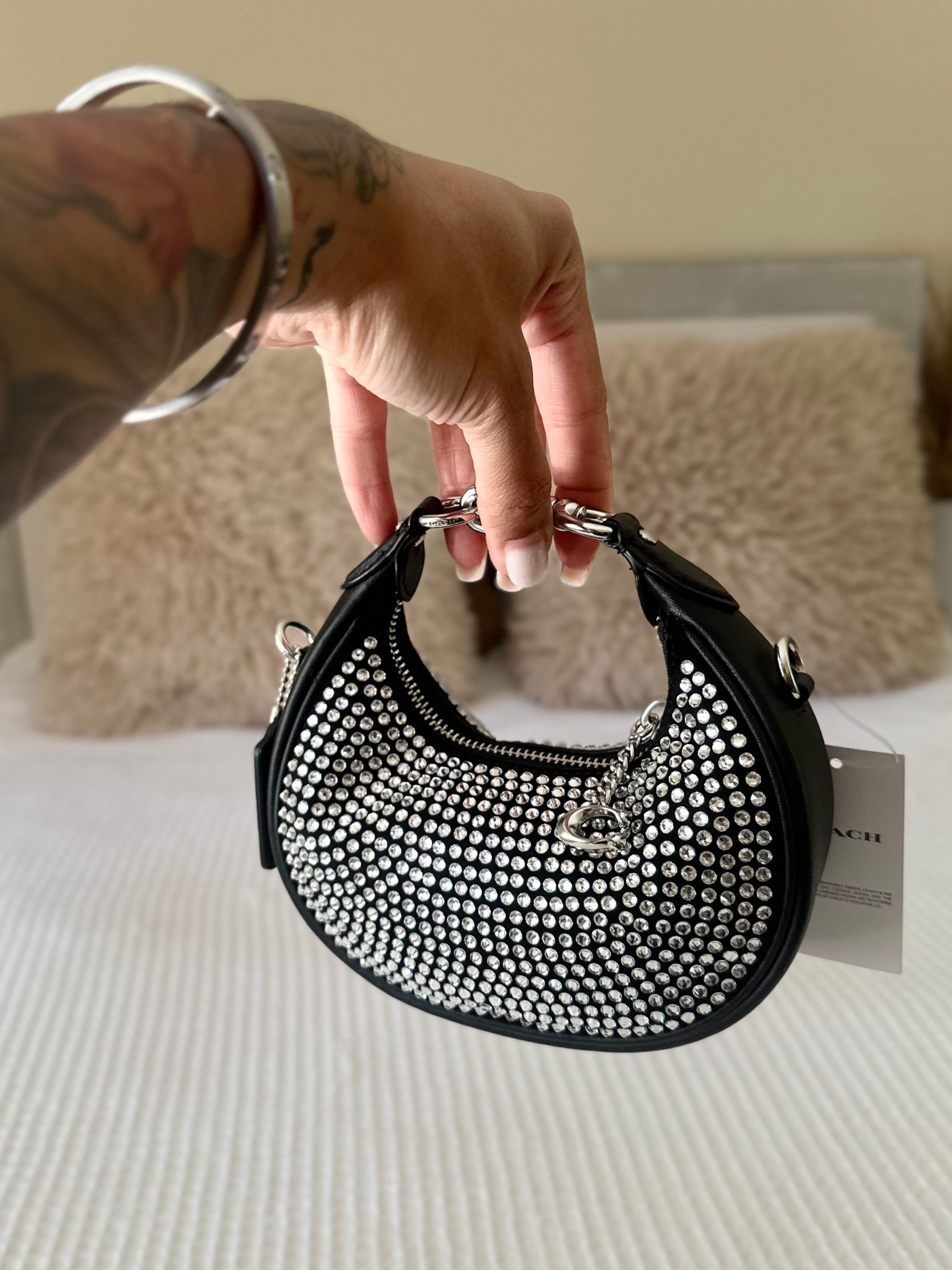 Elevate every look with this Coach Jonie Crystal purse! WARNING: This bag is strictly for carrying lipgloss & bubblegum🤭 

#LTKStyleTip #LTKItBag #LTKSaleAlert