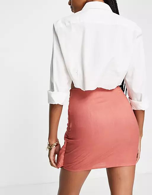 ASOS DESIGN Tall knot wrap mini skirt in rust | ASOS (Global)