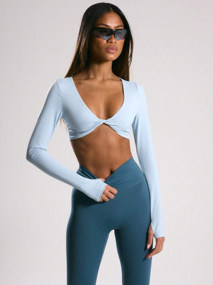 Musera Sport Top corto de manga larga con agujero para el pulgar y detalle de nudo delantero, par... | SHEIN
