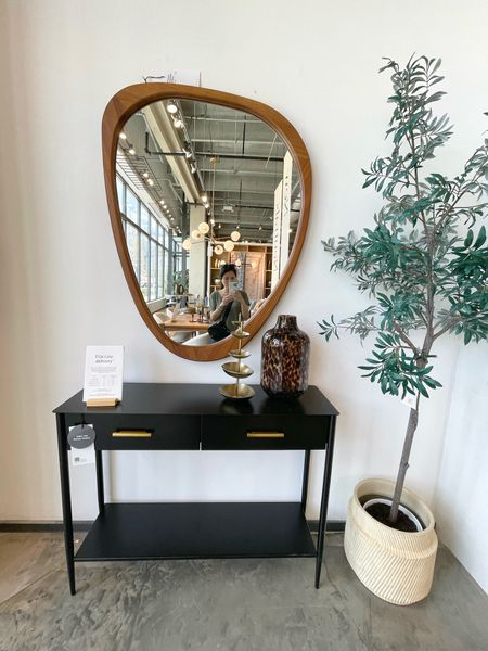 Minimalist modern entryway inspo! 🖤 Sleek simple black metal console table paired with a rustic wood, irregular-shaped mirror! 

#LTKSaleAlert #LTKHome