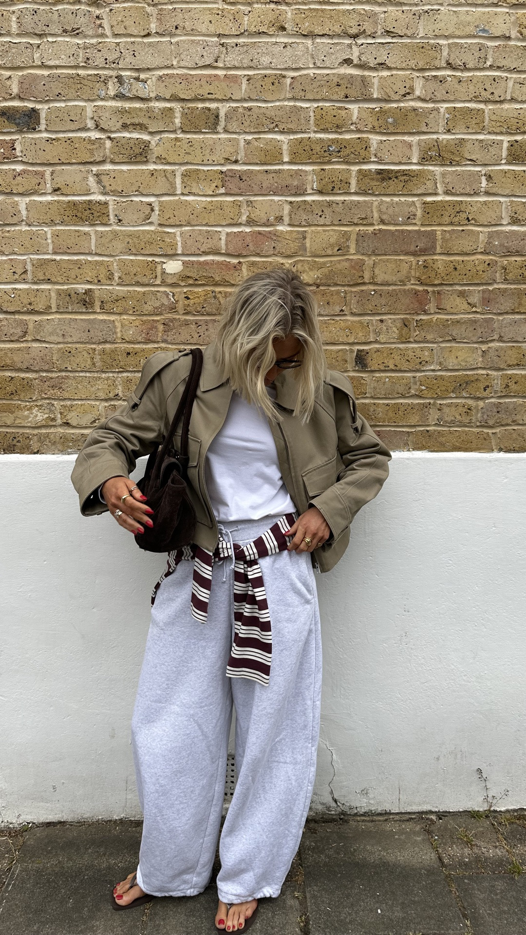 Grey joggers outfit 
Casual outfit 
Spring outfits 
Long sleeve stripe top
Burgundy stripe top
Brown suede handbag
Short trench jacket 
Boxy white tee
Weekend outfit 
Airport outfit ideas

#LTKootd #LTKgrwm