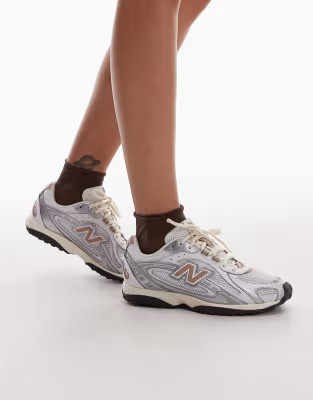 New Balance 204L unisex trainers in white and brown | ASOS (Global)