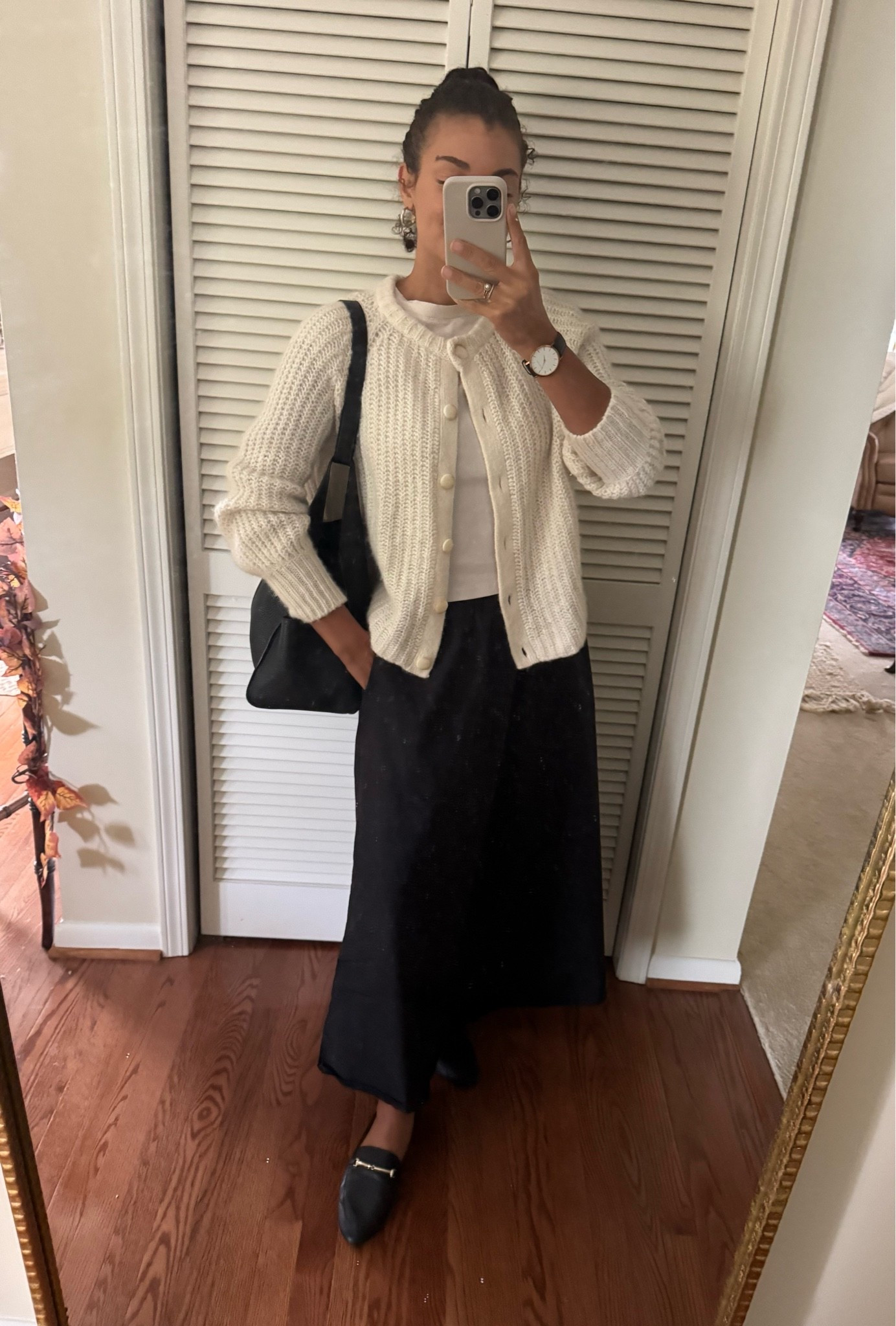 Dressy fall outfit: black skirt, loafers, tote bag, tee, and cardigan