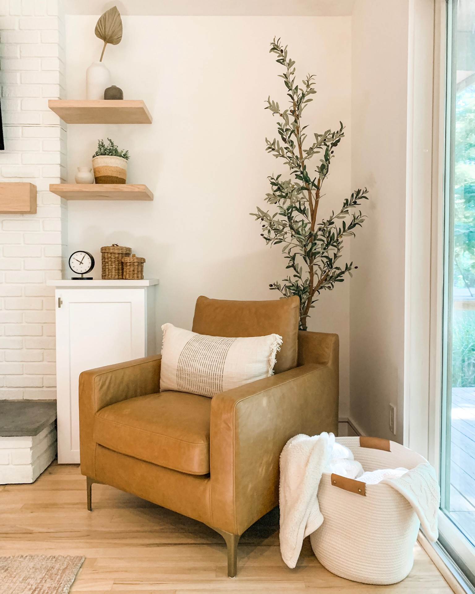 Living room nook at the Chalet

Leather club chair
Side chair
Arm chair
Faux bamboo plant tree
Fireplace mantle 
Wood shelves
Shelf styling
Table clock
Baskets
Throw blanket
Interior decor
Home
Mid century modern

#LTKhome #LTKunder50 #LTKstyletip