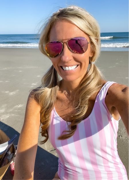 This adorable pink striped one piece swimsuit is on sale from Solid & Striped! I attached some similar swimsuits, my pink aviator sunglasses, pink headband, & my favorite tanning water from Isle of Paradise. 
#ltkswim
#ltku


#LTKunder100 #LTKtravel #LTKsalealert