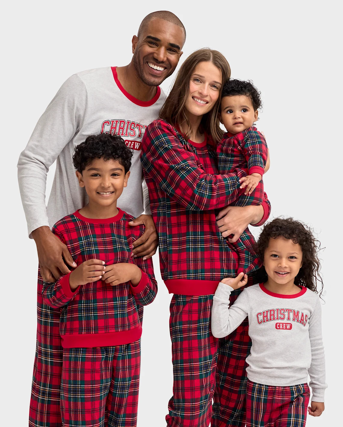 Our Christmas Crew Plaid Collection features coordinating pajamas for the whole family. | The Children's Place