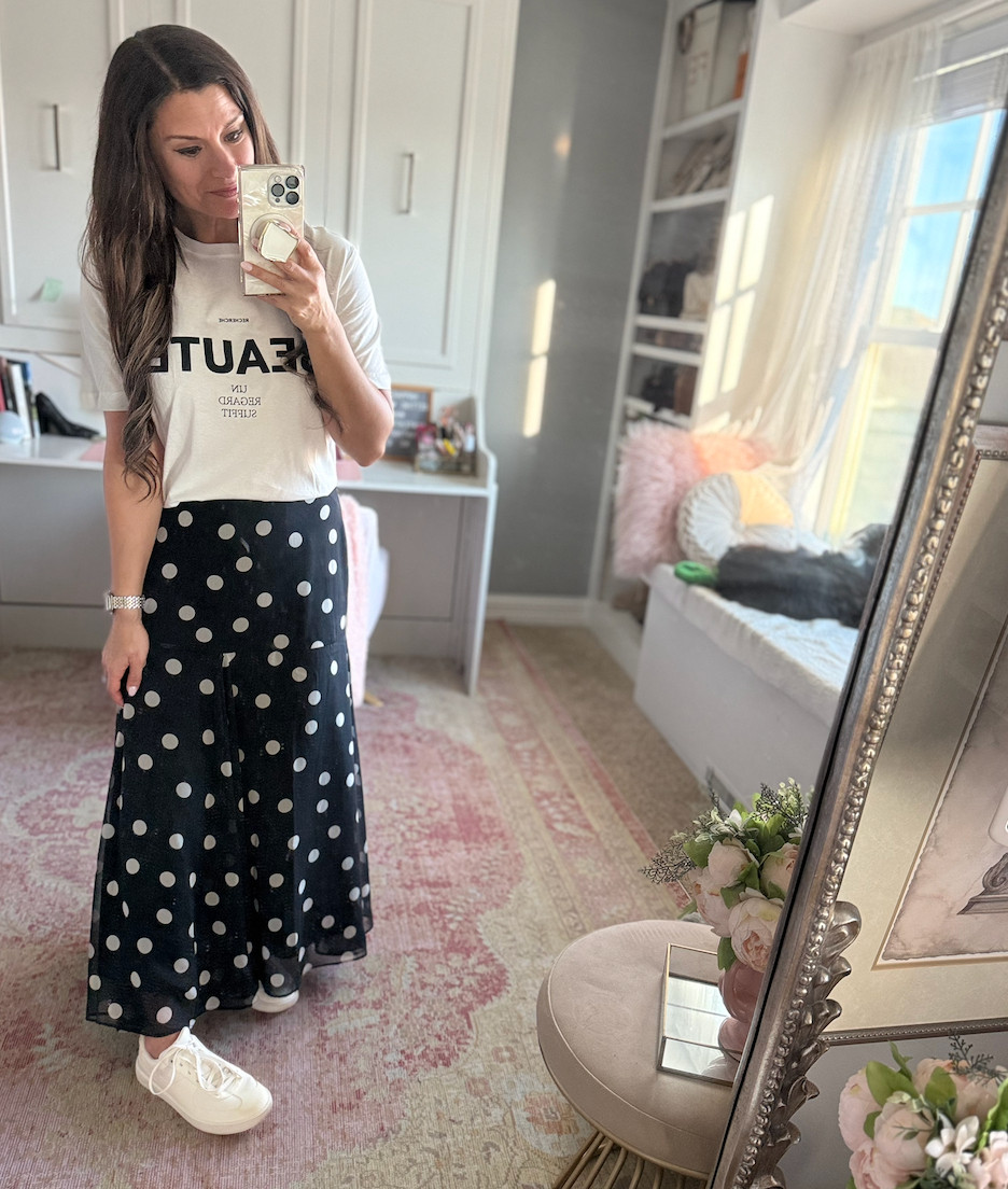 Cute look for spring with a graphic tee and polka dot skirt with sneakers 

 