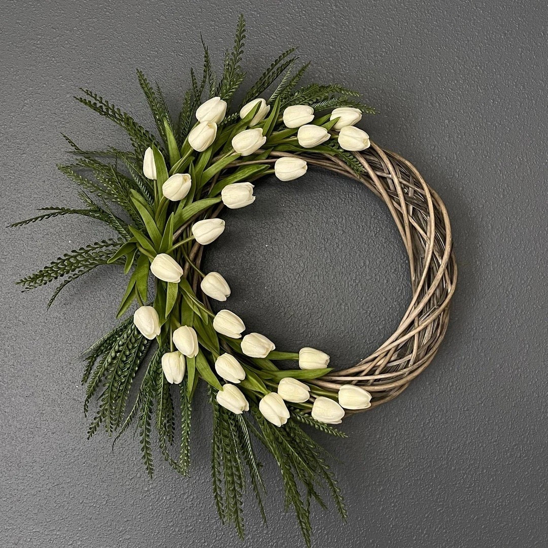 Welcome spring in style with this stunning tulip wreath by SoapMagicCo, designed with lifelike Real Touch tulips that look freshly picked from the garden. Crafted on an 18-inch rattan base and finished at an impressive 22–23 inches wide, this wreath creates a full, vibrant display perfect for front doors, entryways, or brightening up your home year-round. The realistic blooms and high-quality materials make it a timeless seasonal accent that stays beautiful without any upkeep. #springdecor #tulipwreath #frontdoordecor #homedecorfinds #ltkhome #seasonaldecor #farmhousestyle

#LTKSeasonal #LTKHome