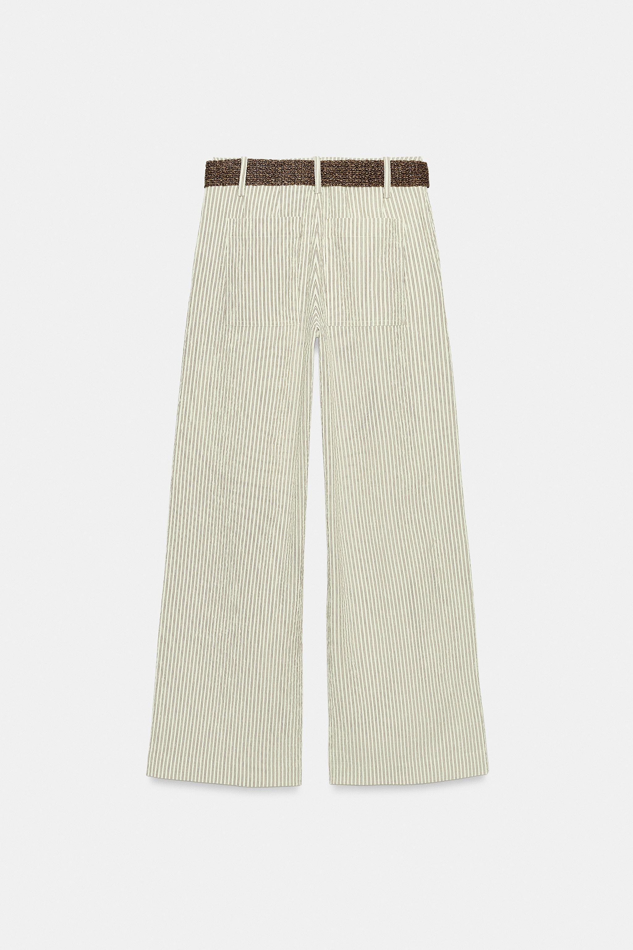 Model height: 177 cmTrousers with a belt and front darts. Featuring front pockets and patch pocke... | Zara UK