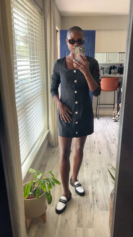 Black long sleeve button front mini dress with gold buttons, black and white loafers with black oval sunglasses  

#LTKshoecrush #LTKworkwear