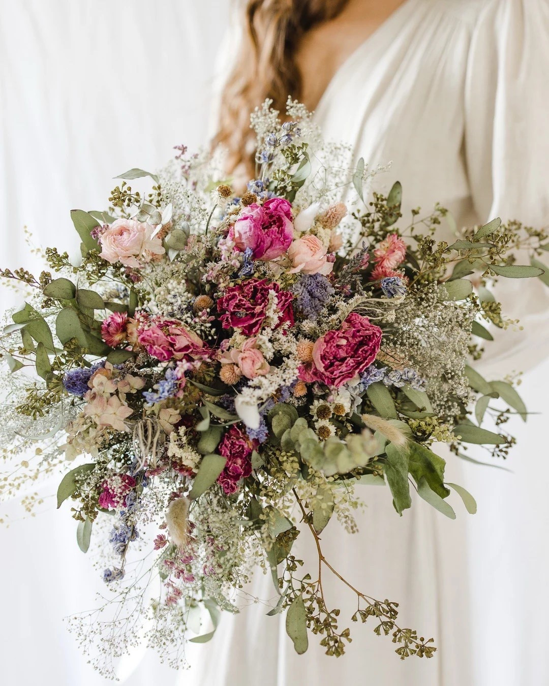 This cascading dried bridal bouquet by NustadFamilyRanch features a stunning blend of ranunculus, peonies, eucalyptus, ammobium, oats, wheat, yarrow, and winged everlasting for a naturally elegant look. Hand-tied with jute twine and crafted from certified organic, farm-direct flowers, this arrangement brings soft texture and romantic movement to weddings, home décor, or gifting. With long stems and cascading design, this bouquet offers timeless beauty that lasts far beyond your special day.

#LTKwedding #LTKhome #LTKstyletip #DriedFlowerBouquet #OrganicFlowers #BohoWedding #RusticWedding #WeddingBouquet #FarmhouseDecor #WeddingInspo #EtsyFinds #LTKFinds #EverlastingFlowers #NaturalHome #NeutralDecor 

#LTKHome #LTKWedding #LTKSeasonal