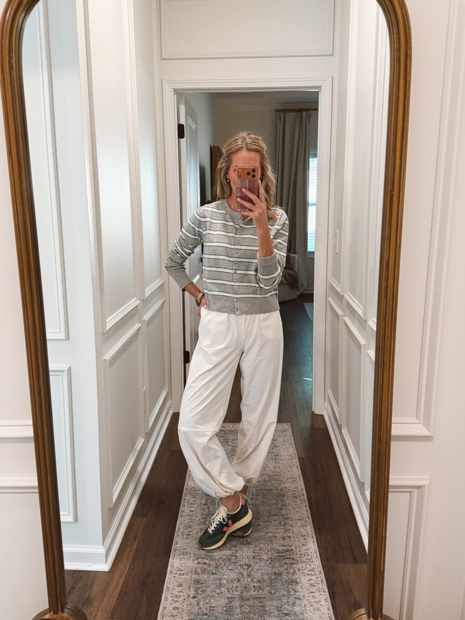 Another Target outfit that I instantly found in love with is this button up sweater cardigan? It comes in eight different colors on sale today. $17. I love it with these high-rise woven adjustable $35 dance pants so fun and would be the perfect travel outfit wearing a size extra small and all.