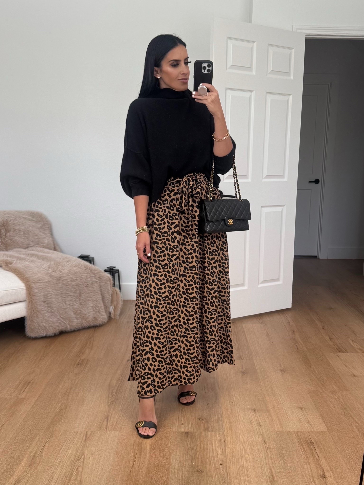 Leopard print mxi skirt from Amazon under $30. Black turtleneck sweater. Gucci heels