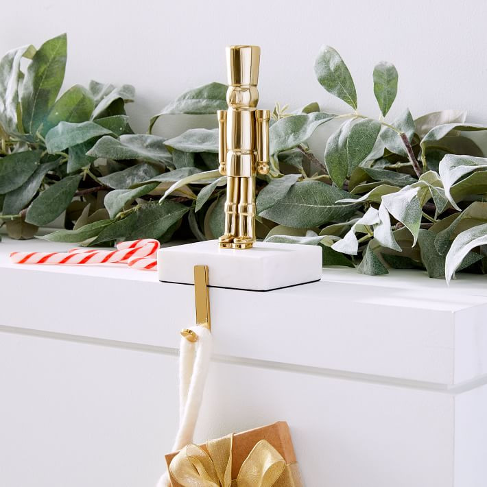 Brass & Marble Nutcracker Stocking Holder | West Elm (US)