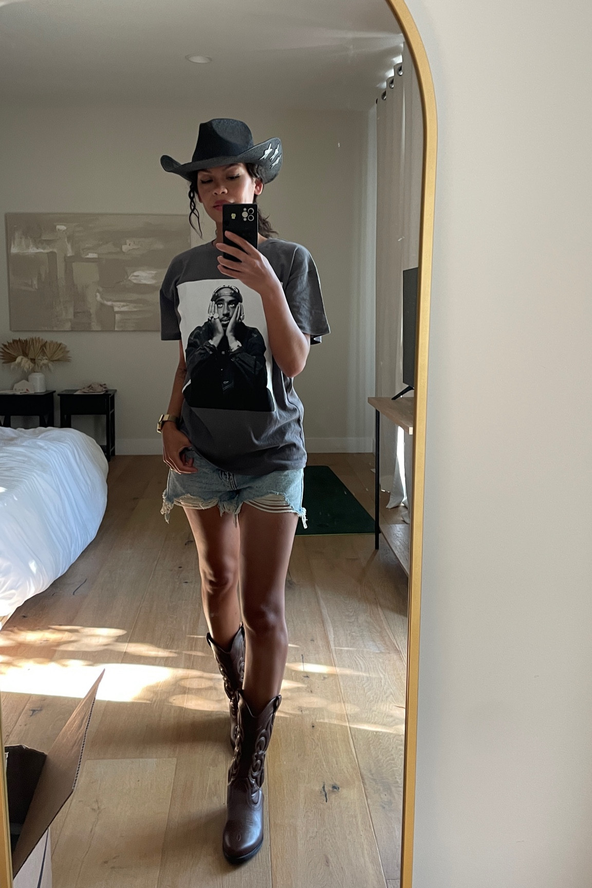 Country concert outfit Cowboy cowgirl look cutoff denim shorts cowboy boots cowboy hat 2pac graphic tee #LTKSummerSales 

#LTKParties #LTKFindsUnder50