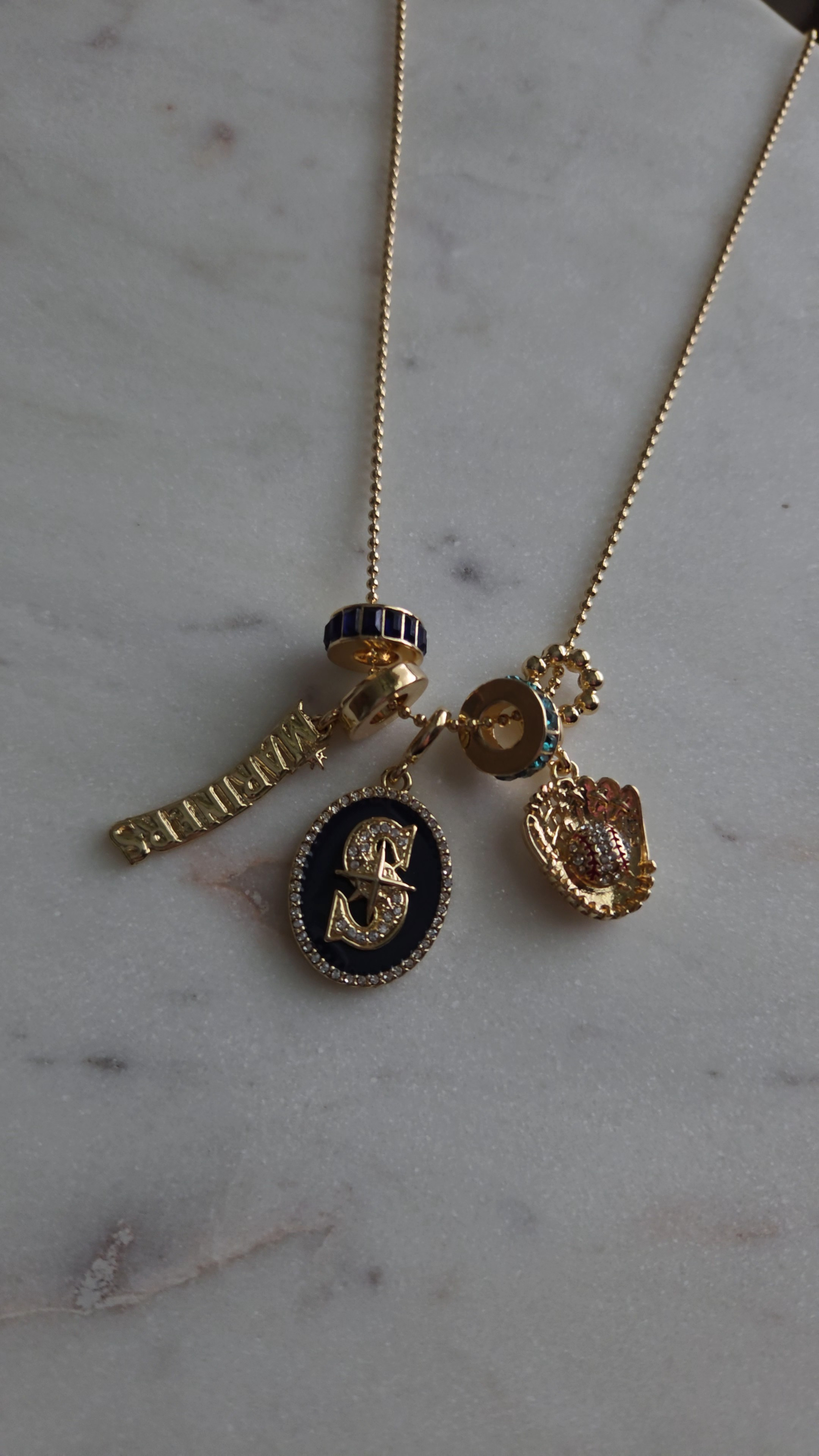 Rep your favorite baseball team with a trendy and sporty term necklace. #Mariners #SeattleSports #charmnecklace #jewelry

#LTKootd #LTKgrwm #LTKdayinmylife