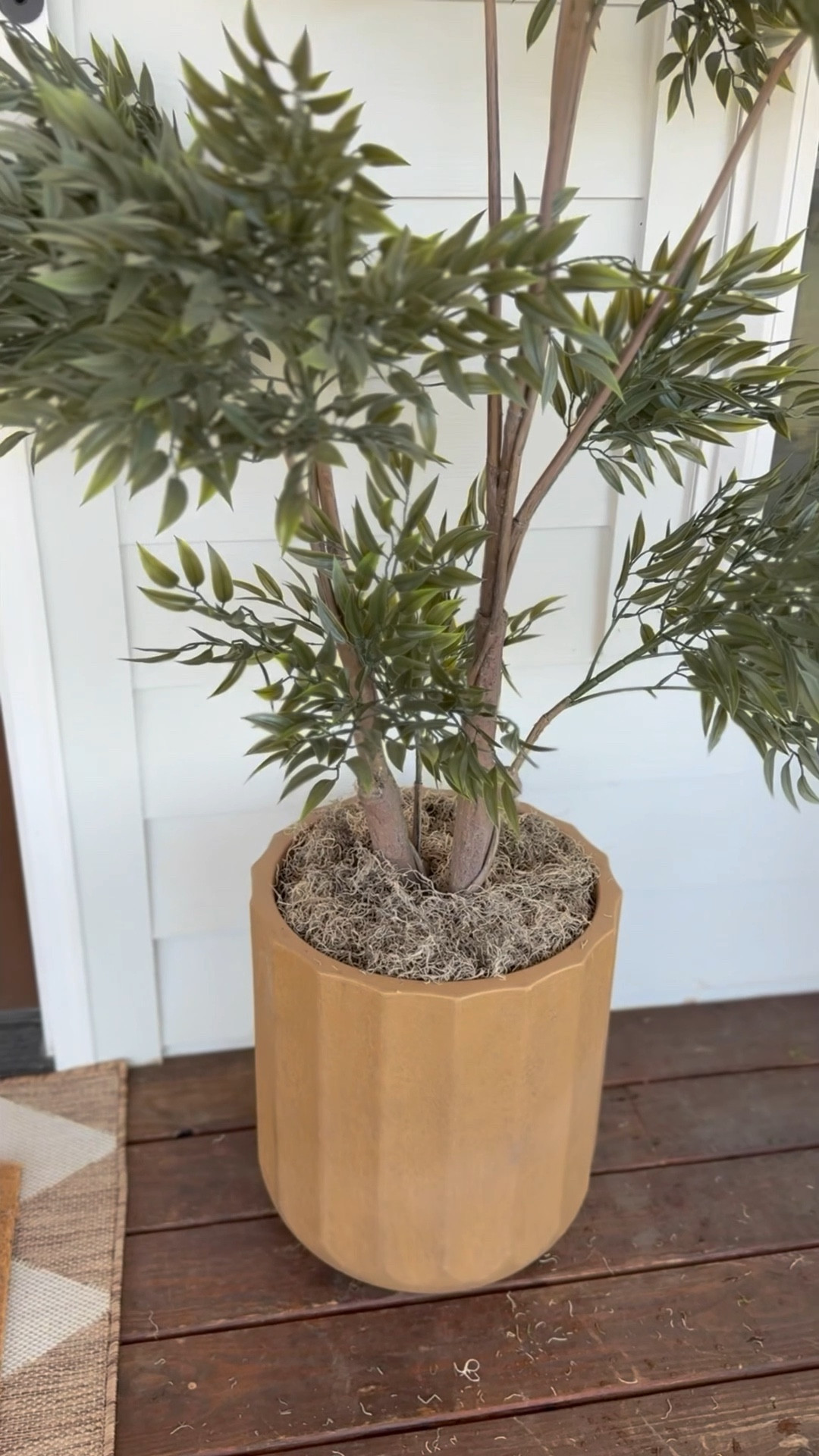 Serves two purposes…adding moss makes your plant look more realistic and it allows you to put weight in the bottom of your planter - which helps with wind! I’ve used everything from bricks to rocks to paint cans! It’s not totally wind proof but it definitely helps! 

#LTKHome #LTKSeasonal #LTKstorytime