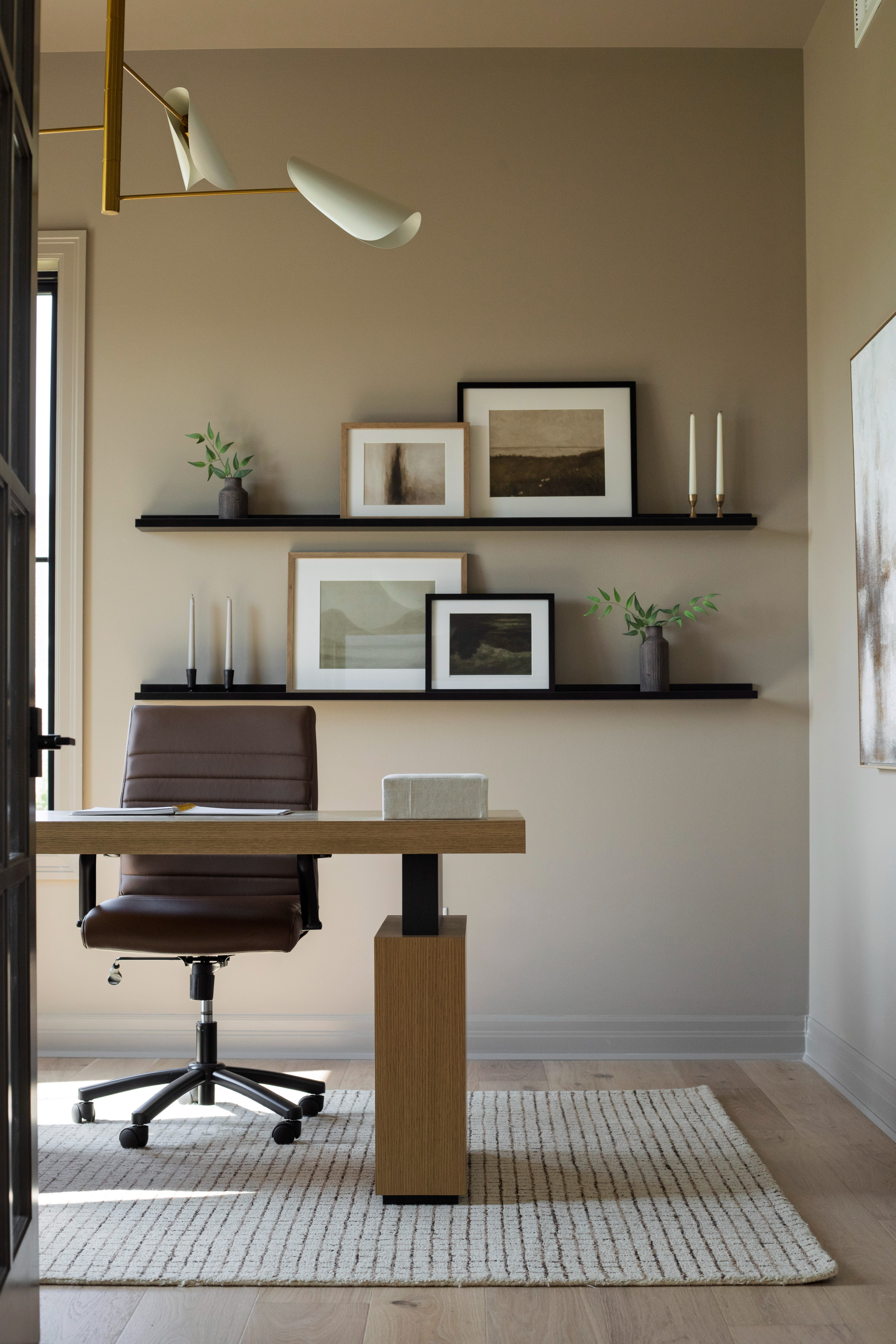 This modern workspace was designed with both style and function in mind. The wood and metal desk makes a refined statement, paired with a leather swivel chair that’s as comfortable as it is chic. The neutral area rug adds warmth and texture underfoot, creating the perfect balance between modern and inviting.

To complete the look, the floating wall shelves are styled with abstract artwork, vases with greenery, and modern candlesticks—simple accessories that make the space feel curated and elevated. Overhead, the modern brass light fixture ties the entire room together with a sculptural, sophisticated touch.

Every piece was chosen to make your workspace beautiful, functional, and inspiring. Shop the furniture, lighting, and styling accessories below to recreate this timeless home office look.

#LTKhome #LTKhomeoffice #LTKhomedecor #LTKfinds #officefurniture #deskdecor #modernoffice #homeofficedecor #workfromhome #leatherdeskchair #neutraldecor #wooddesk #modernlighting #brasslightfixture #floatshelves #wallartdecor #minimaliststyle #organicluxuryliving #homestyling #LTKhomeinspo #officedesign #interiorstyling 

 #LTKHome #LTKSaleAlert #LTKStyleTip