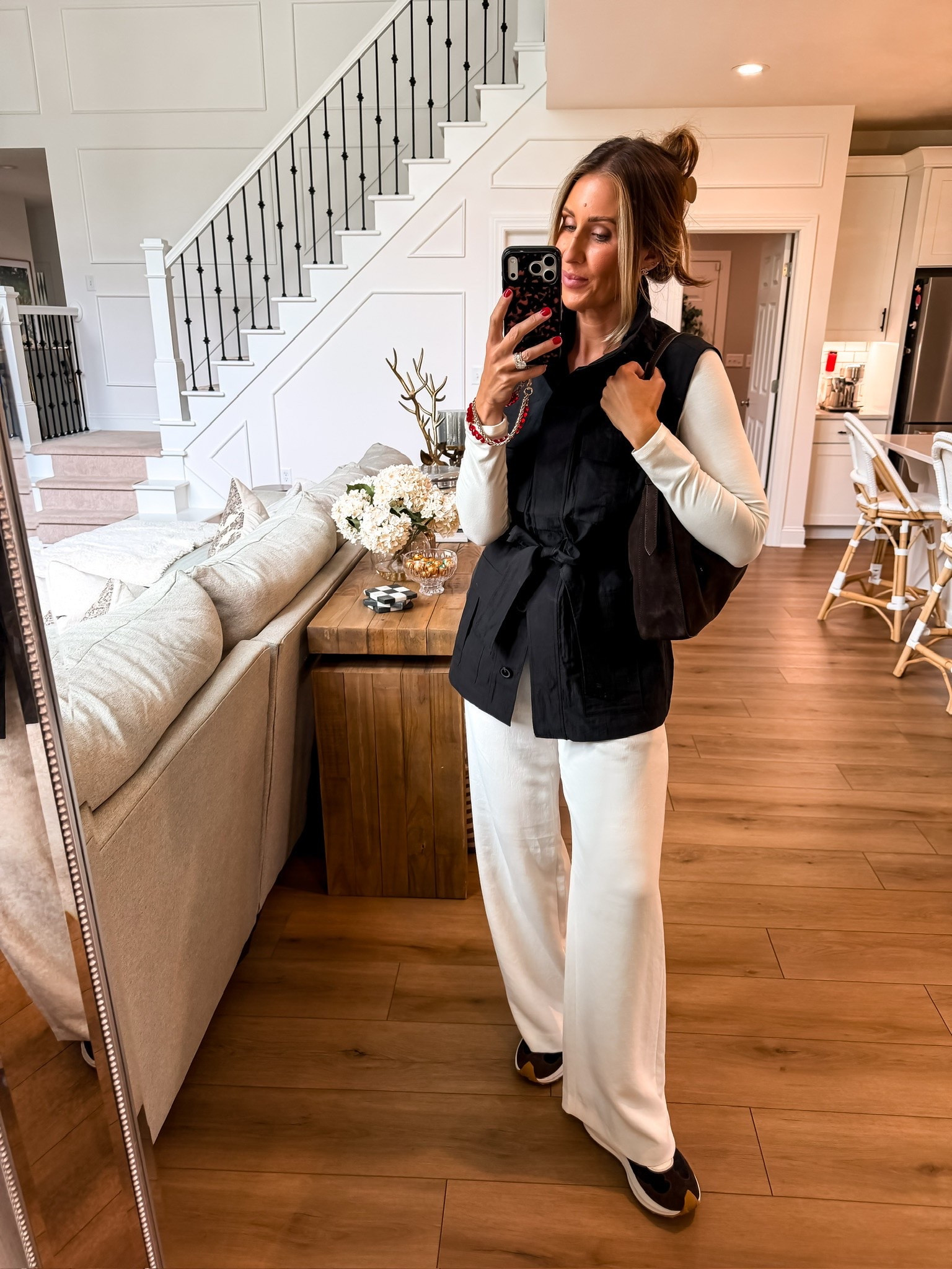 This black and white outfit is such a good early fall combination. The long black utility vest adds a little structure over the simple long sleeve top, while the wide leg white pants and sneakers keep the look comfortable and easy for everyday wear.

black utility vest, white wide leg pants, black and white outfit, fall transition outfit, casual fall style, everyday outfit, neutral outfit, themominstyle 

 #LTKootd #LTKSeasonal #LTKOver40