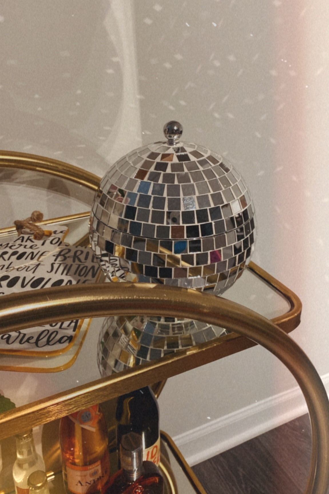 Absolutely zero regrets when it comes to this ice bucket purchased for my bar cart. I love all the added light that the disco ball decor adds when I turn my lights on! 🪩 // mid century modern home, bar cart decor, gold bar cart, cute bar cart 

#LTKhome #LTKunder100