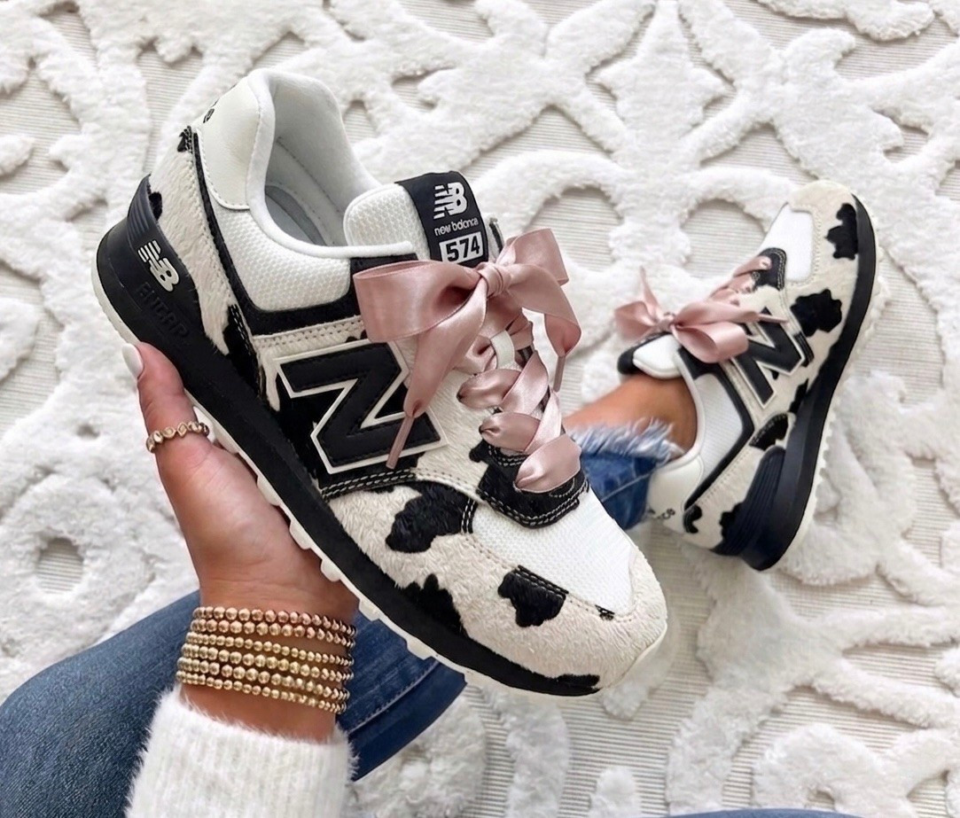 New balance cow print sneakers runs true to size. Changed the laces for $10