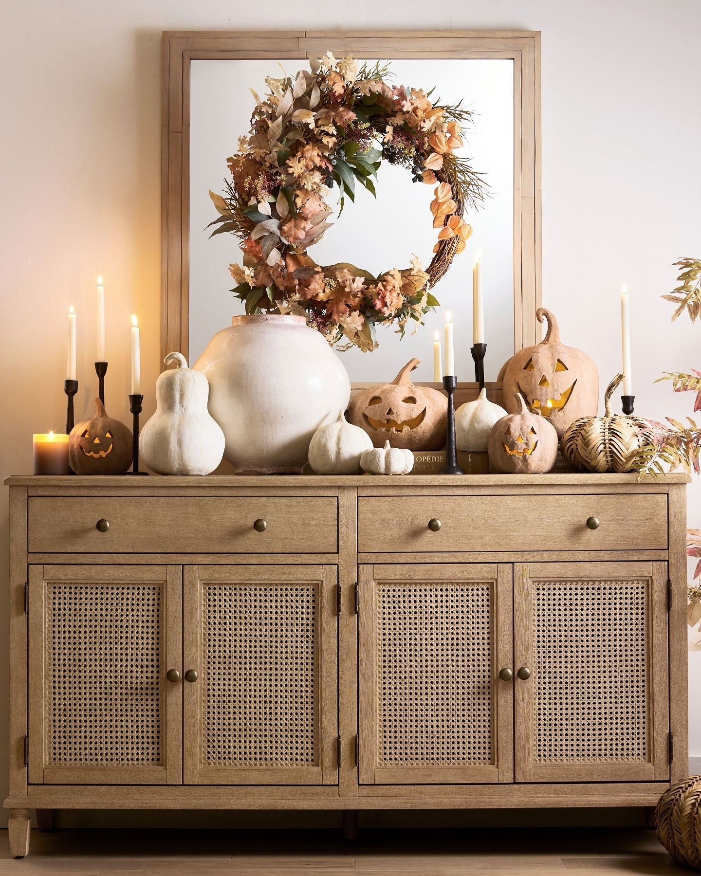 The Sausalito collection, with its wood frame and airy cane detailing, embodies a relaxed yet refined aesthetic. The simple lines and classic features allow it to seamlessly complement various settings, whether placed in a dining room or a family room. The cane accents add a light, breezy feel, while the sturdy wood frame ensures durability, making it a versatile and timeless addition to any space. 
Add fall decor, such as terracotta pumpkins and gourds, to bring a warm, seasonal vibe to the space. The earthy tones of the terracotta complement the natural wood and cane, enhancing the cozy, inviting feel of your autumn decor.

#LTKHalloween #LTKSeasonal #LTKHome